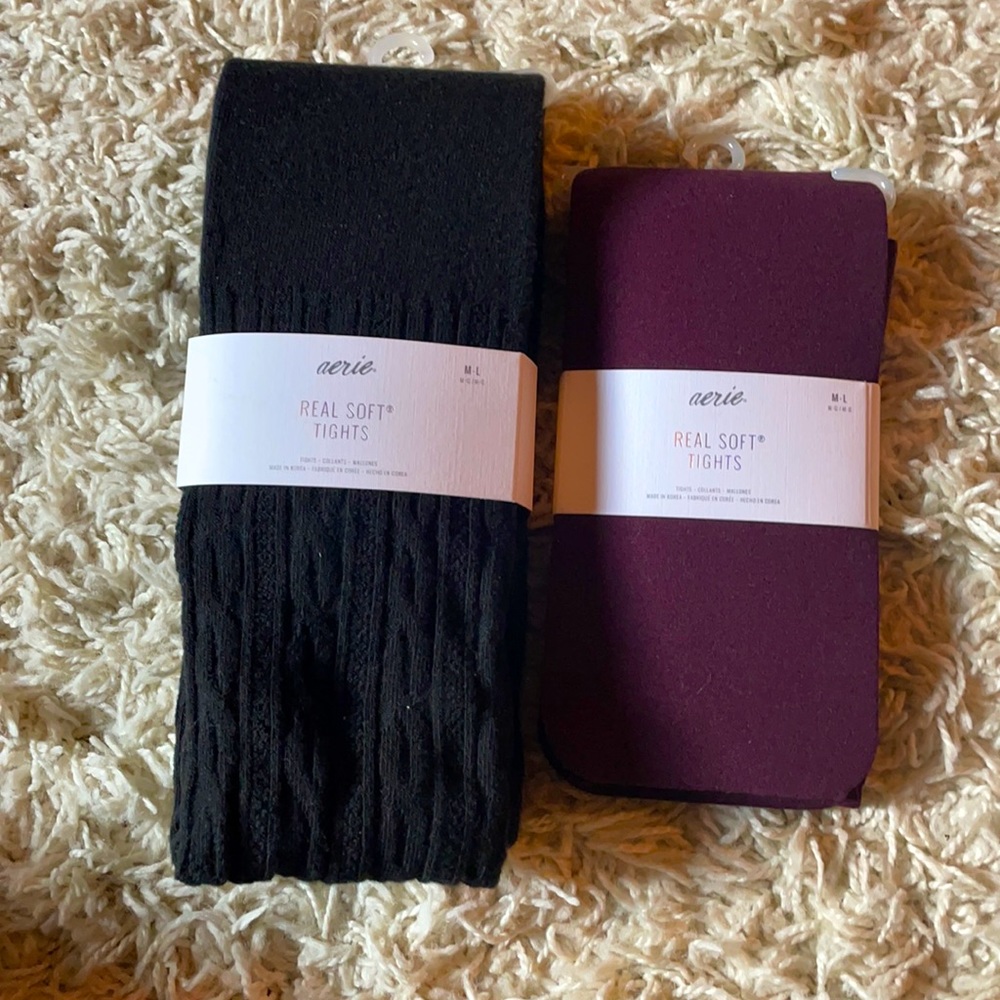 Two pairs of Aerie tights in black and burgundy.